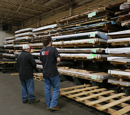 Employees looking at inventory racks