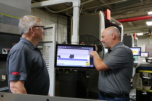 Unifab Employees Setting Up Machine Settings