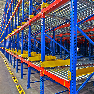 Brightly colored bulk displays with conveyor systems in a warehouse